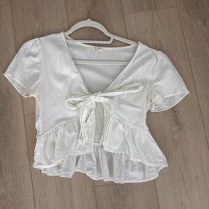 this white flowy top is a size S from Brandy Melville